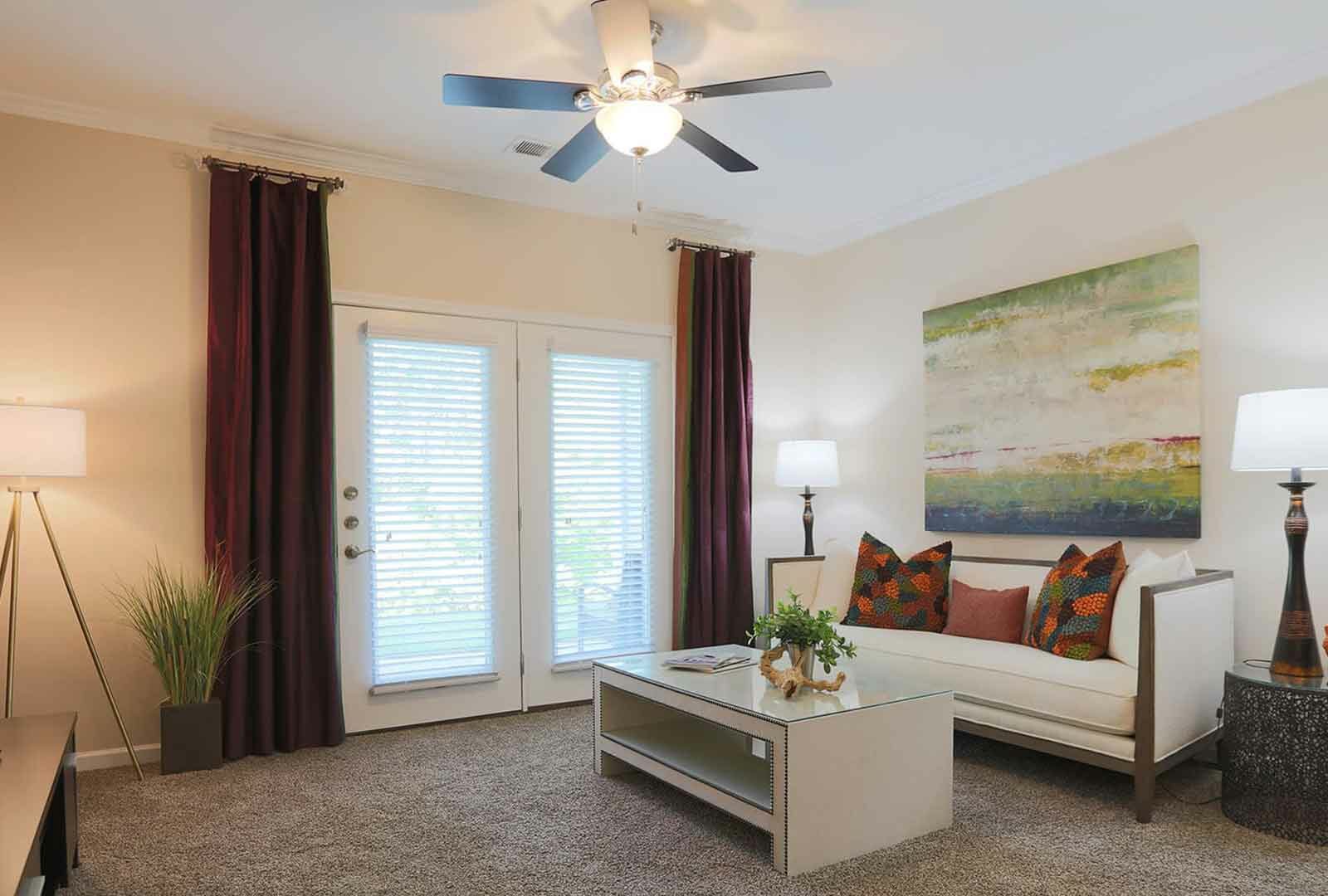 Furnished carpeted living room.