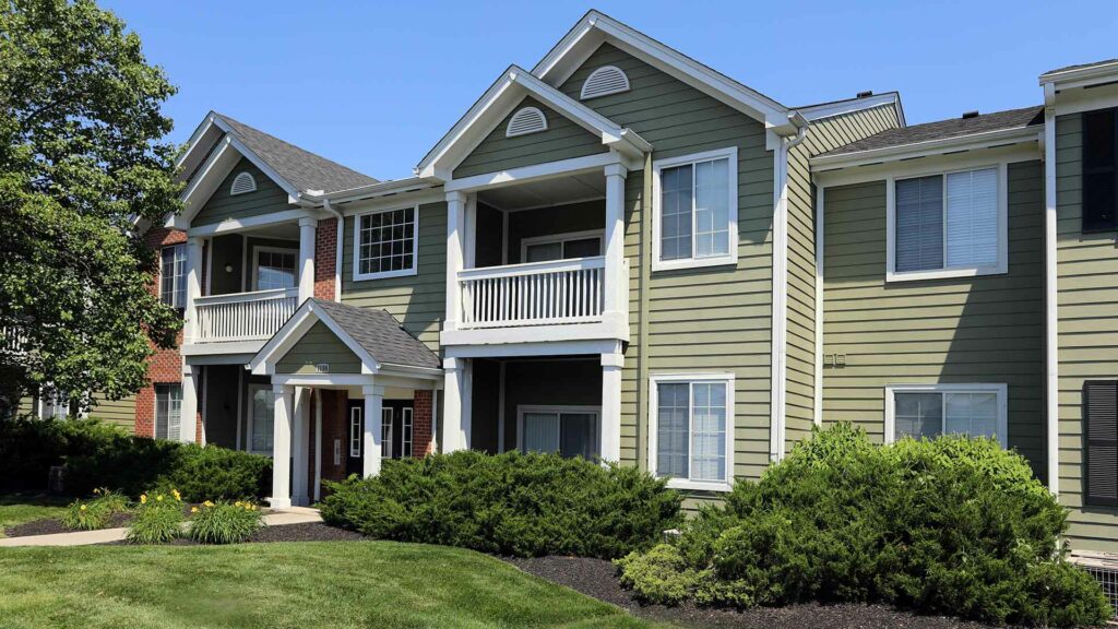 Apartment building exterior and landscaping at Emerald Lakes.