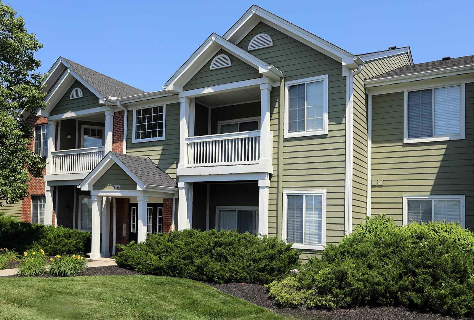 Apartment building exterior and landscaping at Emerald Lakes.