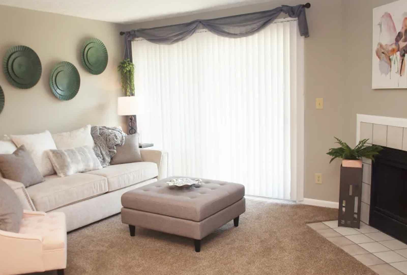 Decorated living space with fireplace at Fox Chase South.