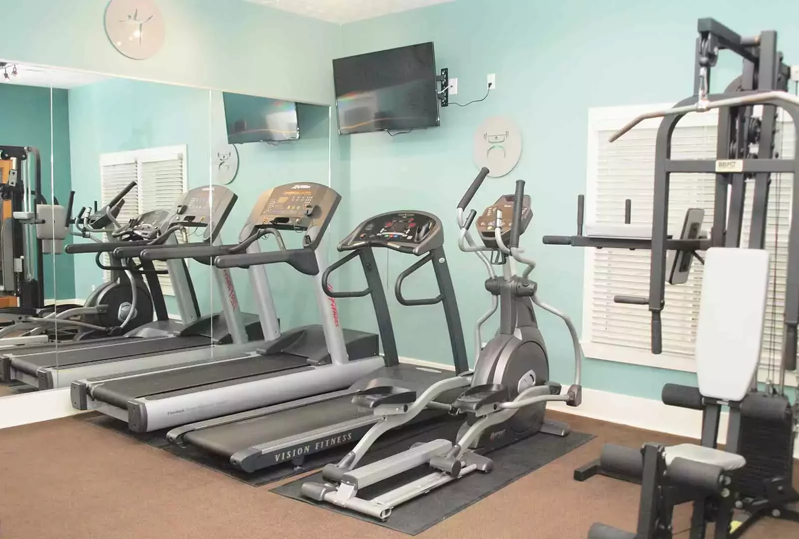 Fitness center with machines at Fox Chase South.