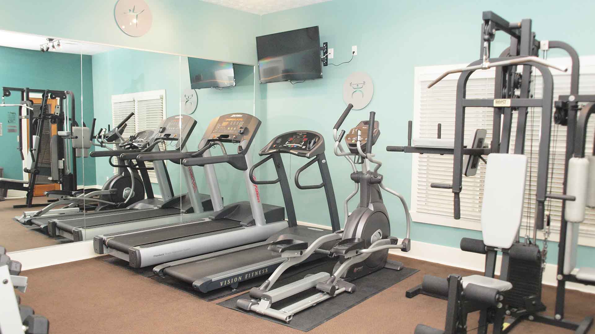 Fitness center with machines at Fox Chase South.