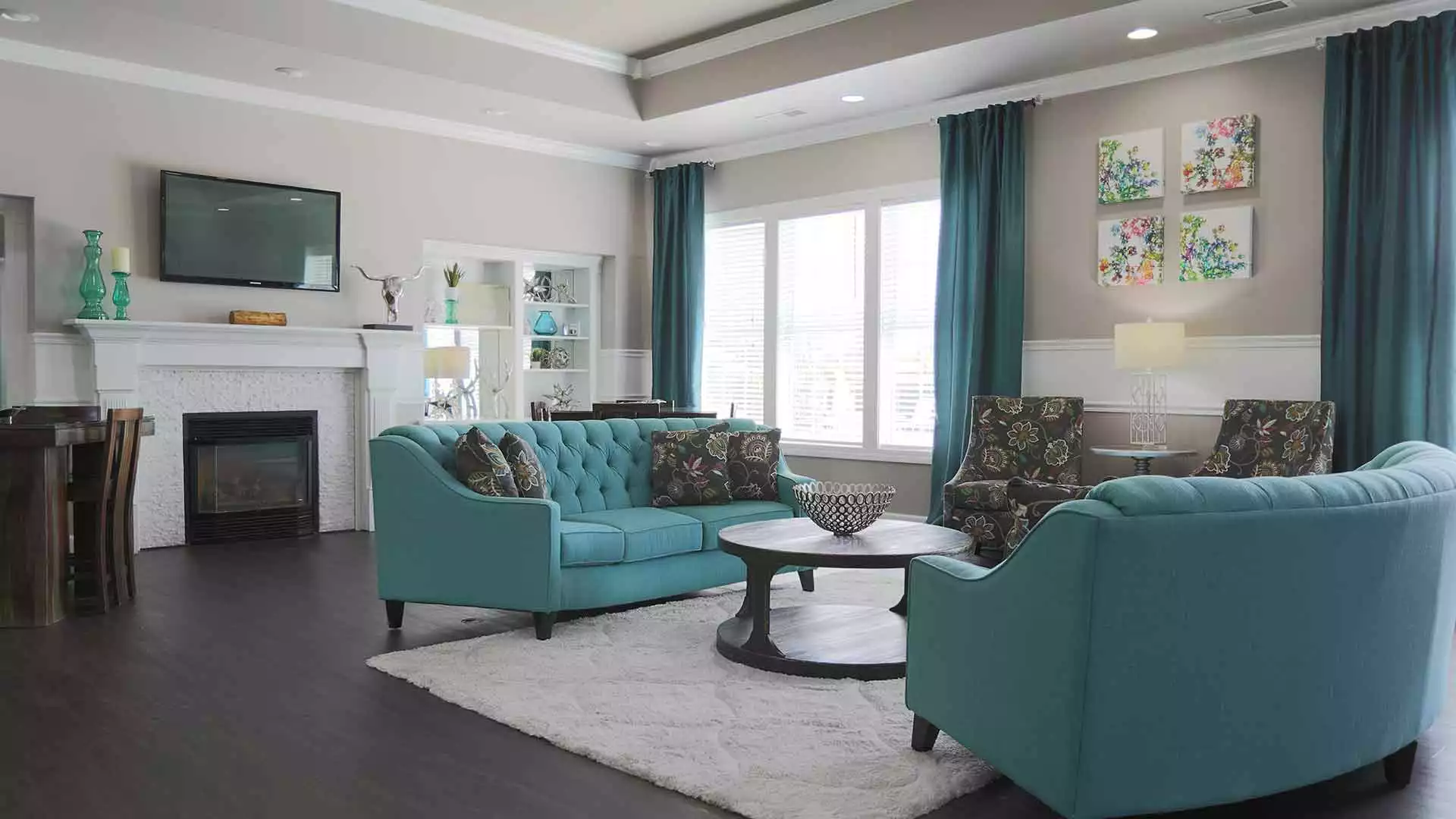 Residential lounge furnished and decorated with furniture and TV.