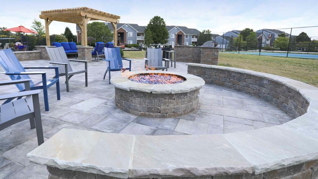A community firepit and patio at Landings at Beckett Ridge.