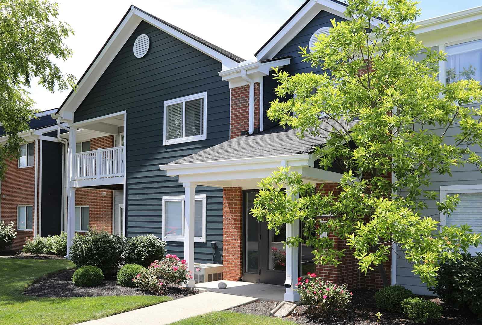 Apartment building exterior with balconies and landscaping at Mallard Landing.