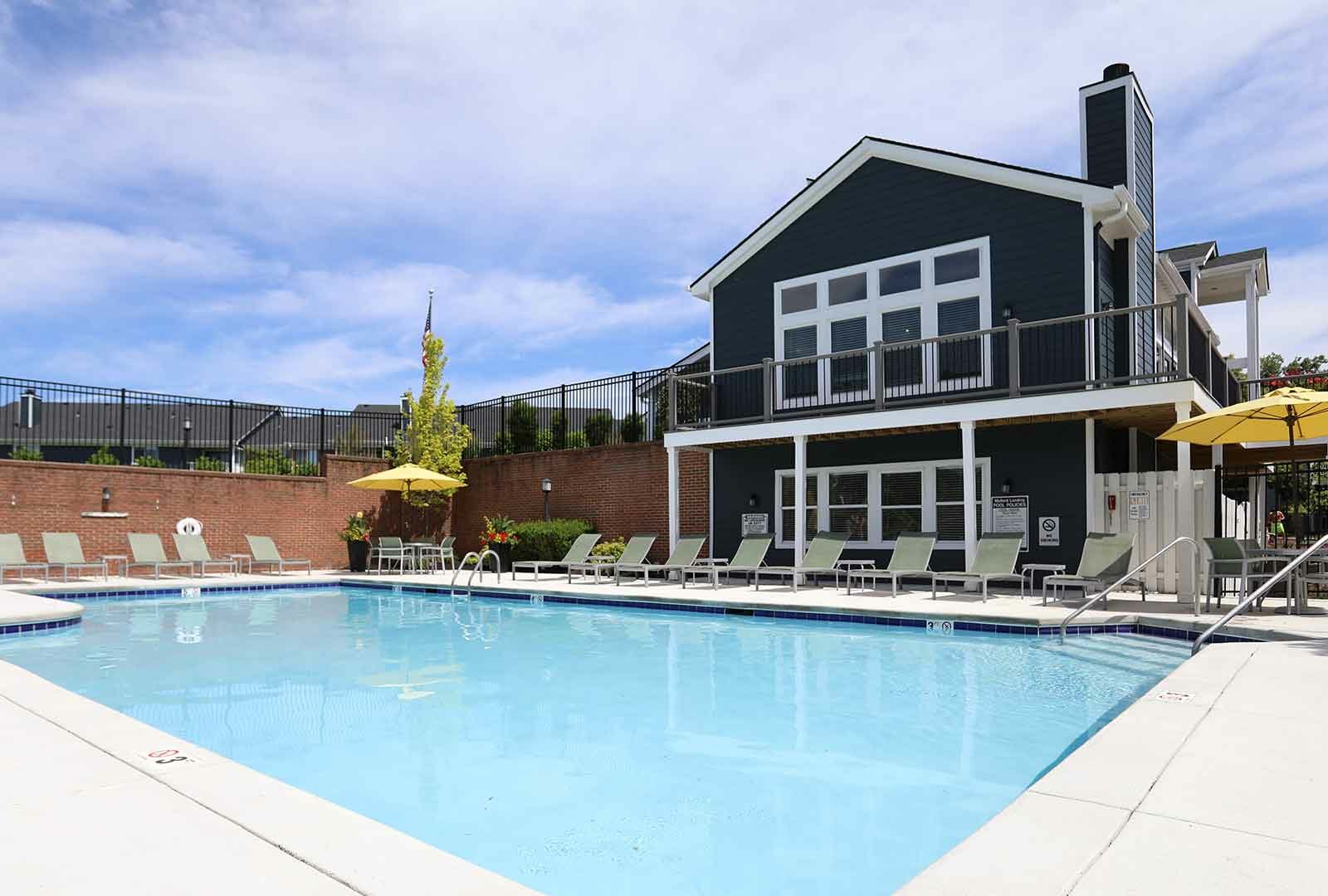 Community pool with lounge chairs at Mallard Landing.