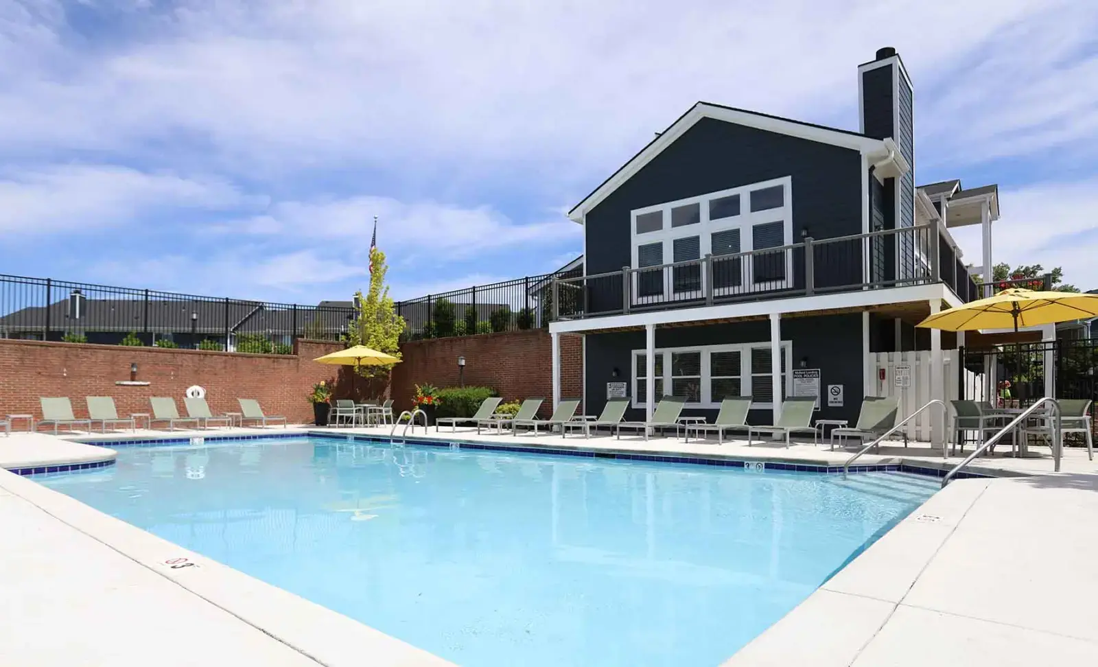 Community pool with lounge chairs at Mallard Landing.