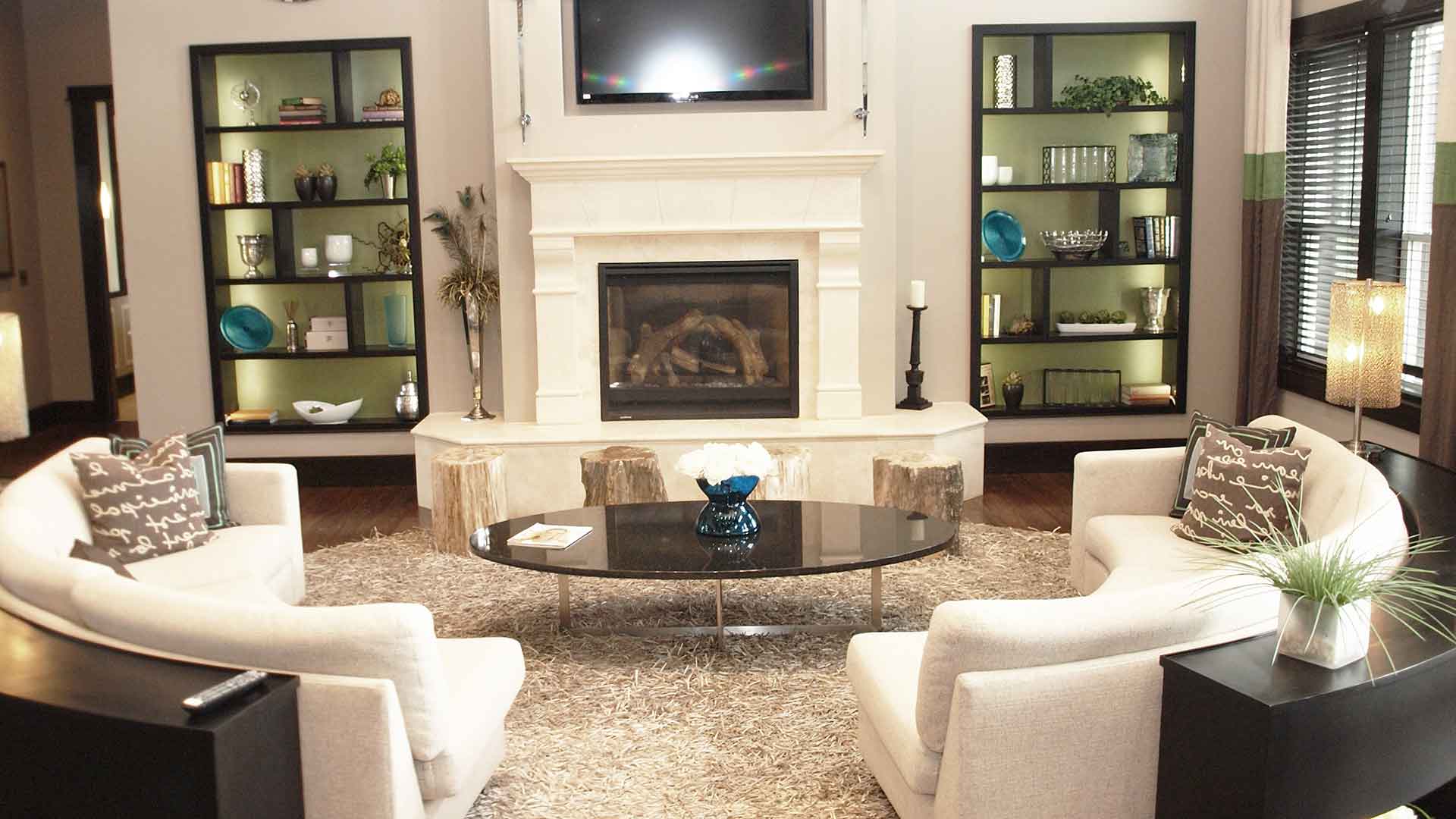 Decorated resident clubhouse with a TV and fireplace at Palmera.
