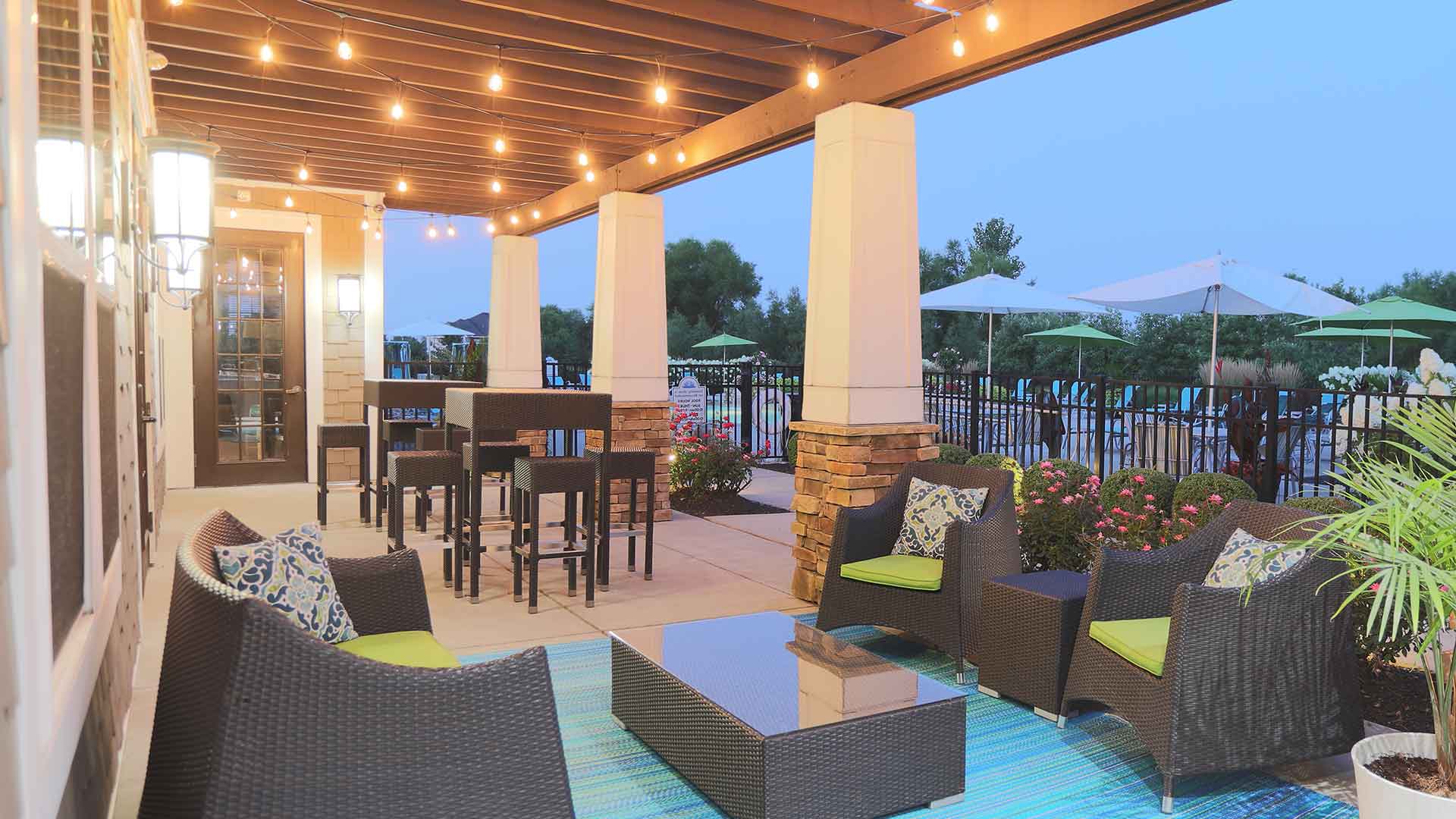 Spacious, furnished poolside outdoor patio space at Palmera.