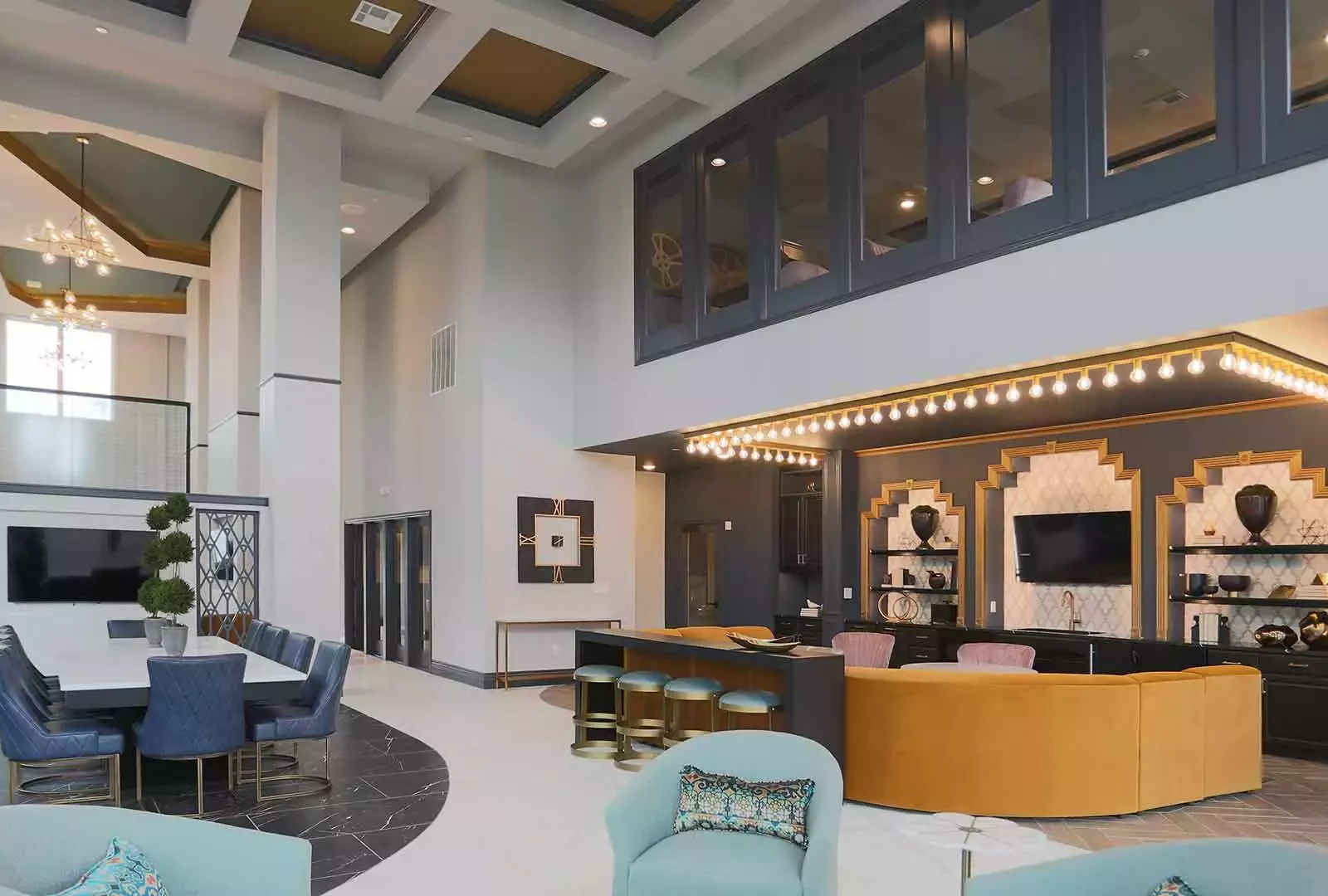 Beautifully decorated community space with a conference table and lounge seating.