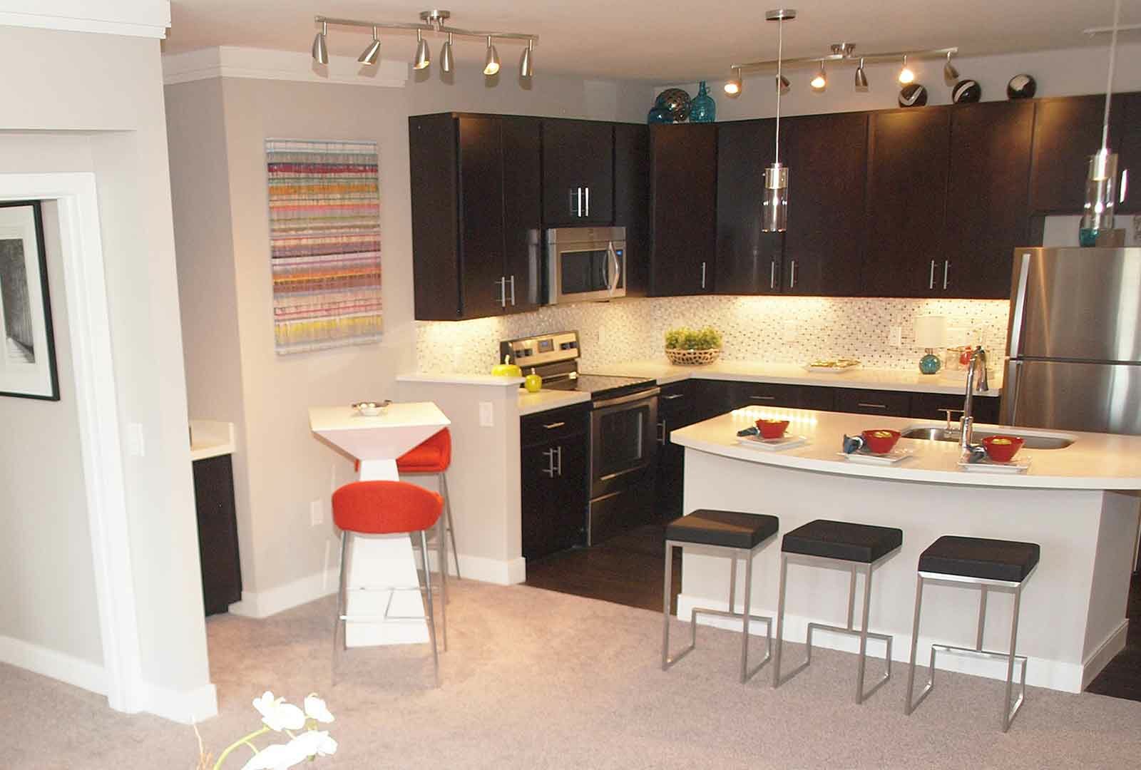 Decorated kitchen and dining area at Savoy of West Chester.