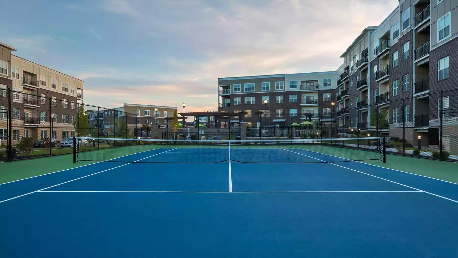 Fenced in tennis court at Savoy of West Chester.