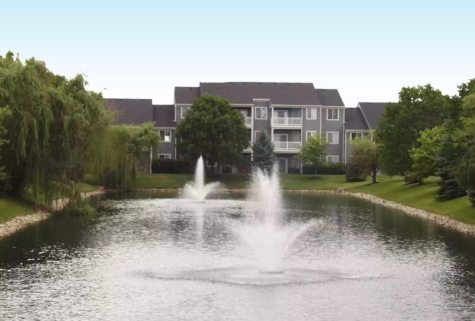 Small lake with fountains outside Sterling Lakes.