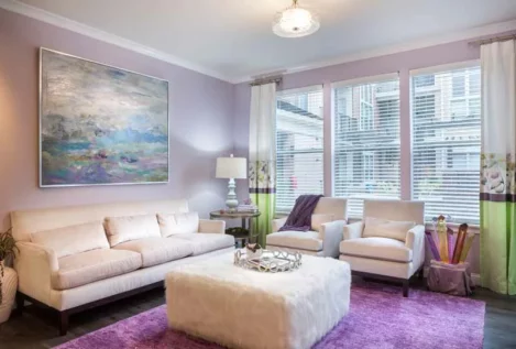 Decorated living room space with large windows at 49Hundred.