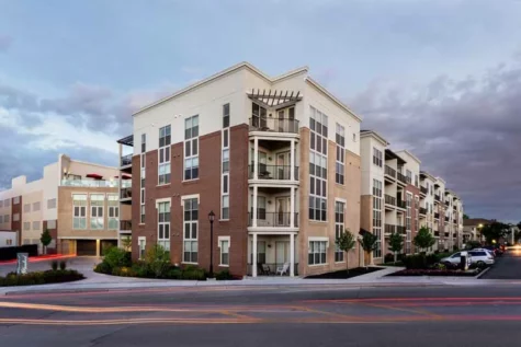 Street view of the 49Hundred complex showcasing in-building parking and balconies.