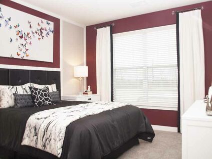 Spacious bedroom with a large window at Allure.