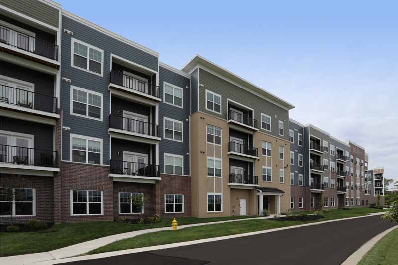 Element Oakwood apartment building exterior with balconies.