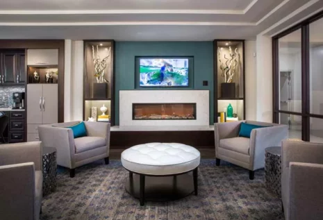 Resident lounge fireplace with seating.