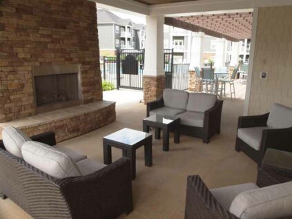 Outdoor patio with fireplace at Kendal on Taylorsville.
