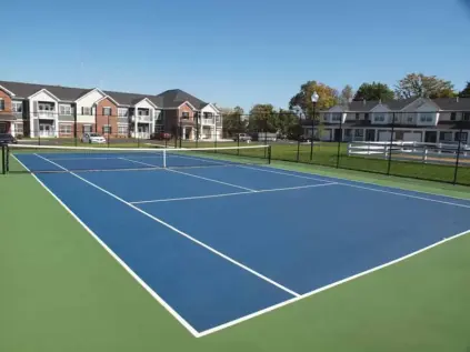 Fenced-in tennis court at Kendal on Taylorsville.