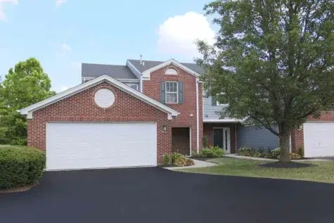 Townhome exterior with two car garage at Landings at Beckett Ridge.
