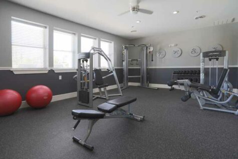 Fitness center with free weights and machines at Mallard Landing.