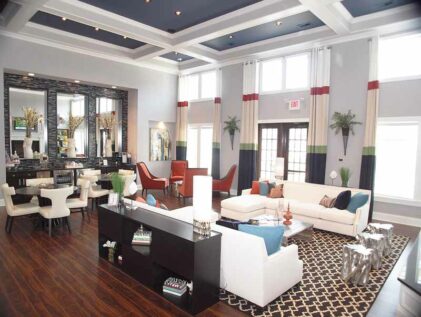 Luxury clubhouse with large ceilings and beautiful furniture.