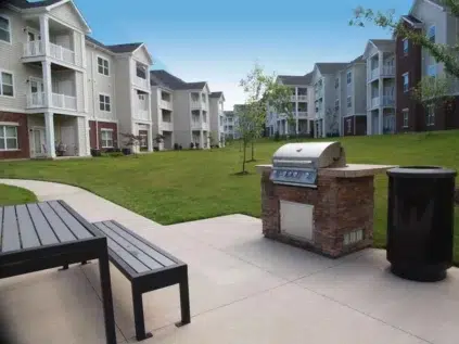 Outdoor community picnic area and grill station at Meridian on Shelbyville.