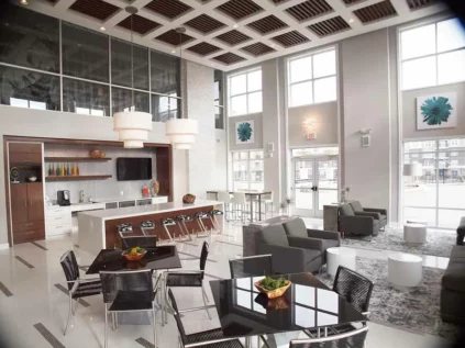 Modern resident area with a coffee bar and seating.