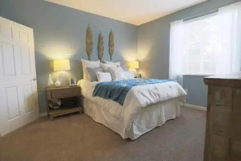 Beautiful bedroom furnished with full bedroom set.