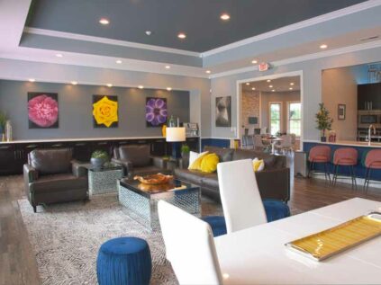 Wide open clubhouse with beautiful decor and furniture.