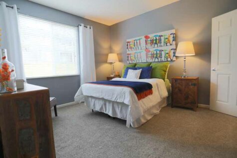 Spacious bedroom with large windows at Shadow Ridge.