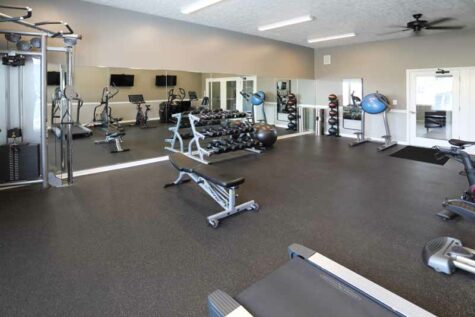 Fitness center with free weights and exercise machines at Shadow Ridge.