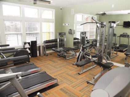 Fitness center with machines and free weights at Waterford Place.