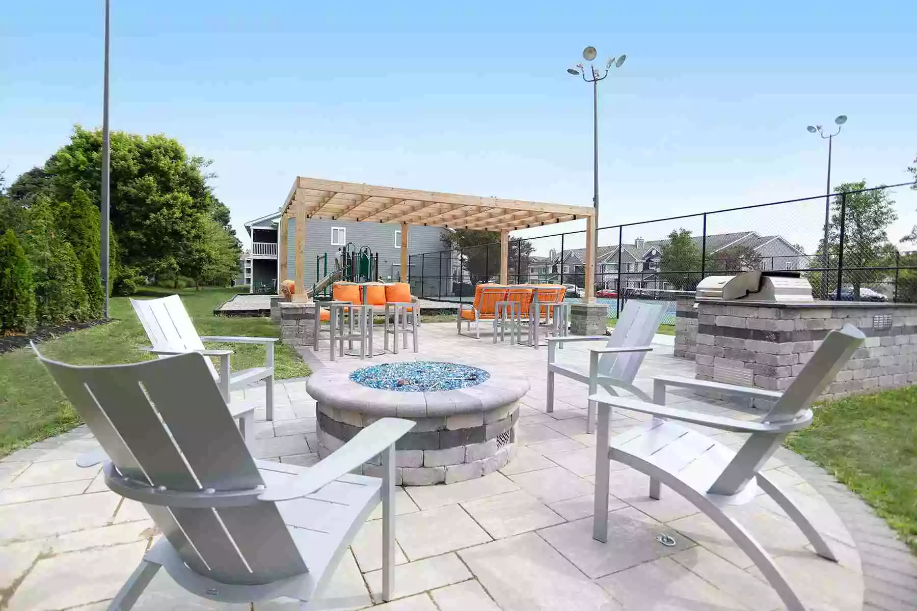 Apartment patio with gas fire pit and cabana.