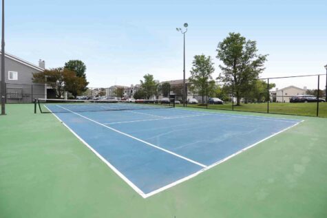 Community tennis court at Island Club Apartments.