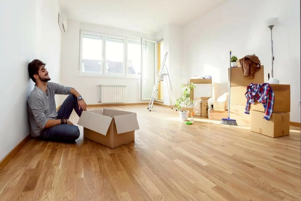 A man moving into his new apartment