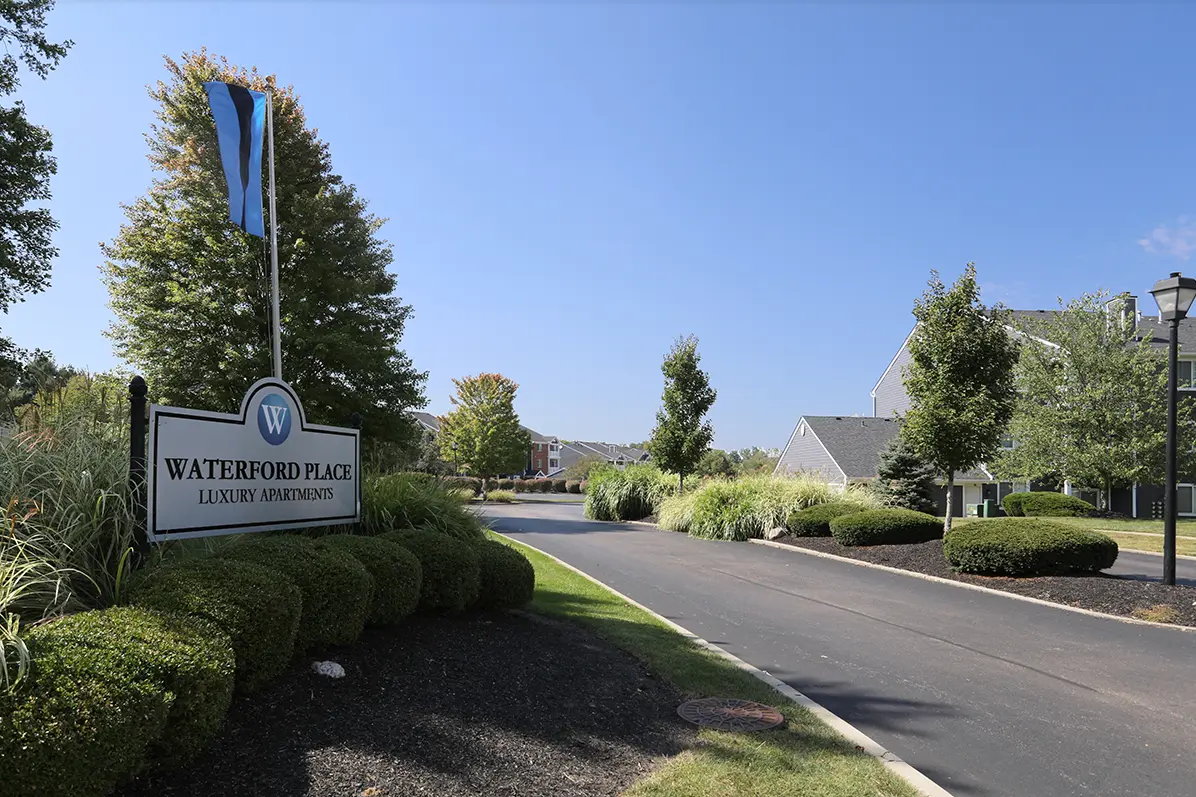 Waterford Place sign, with flag entrance to complex