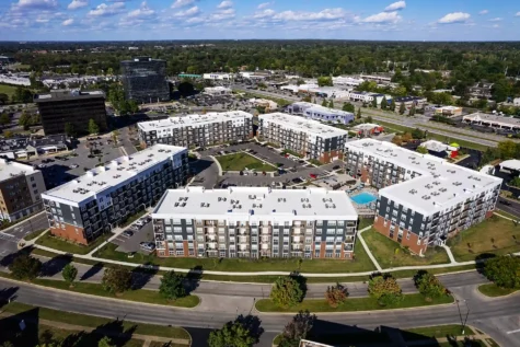 Skyview of Rialto on Hurstbourne. 5 buildings, 5 stories high apartments. Spa pool in the middle. Plenty of parking