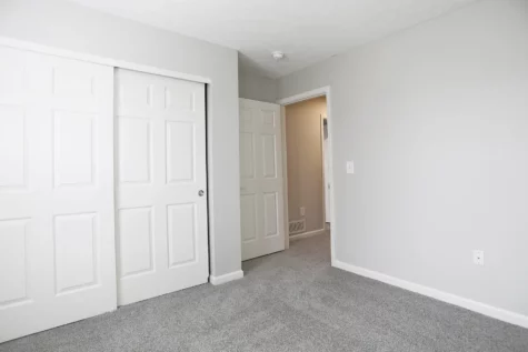 Empty bedroom with large closet doors at The Landings at Beckett Ridge apartments