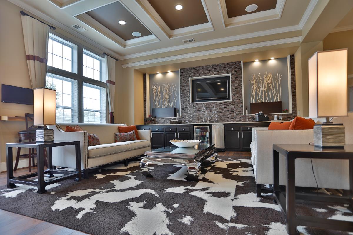The interior of Brinley Place's clubhouse, featuring natural colors and modern seating.