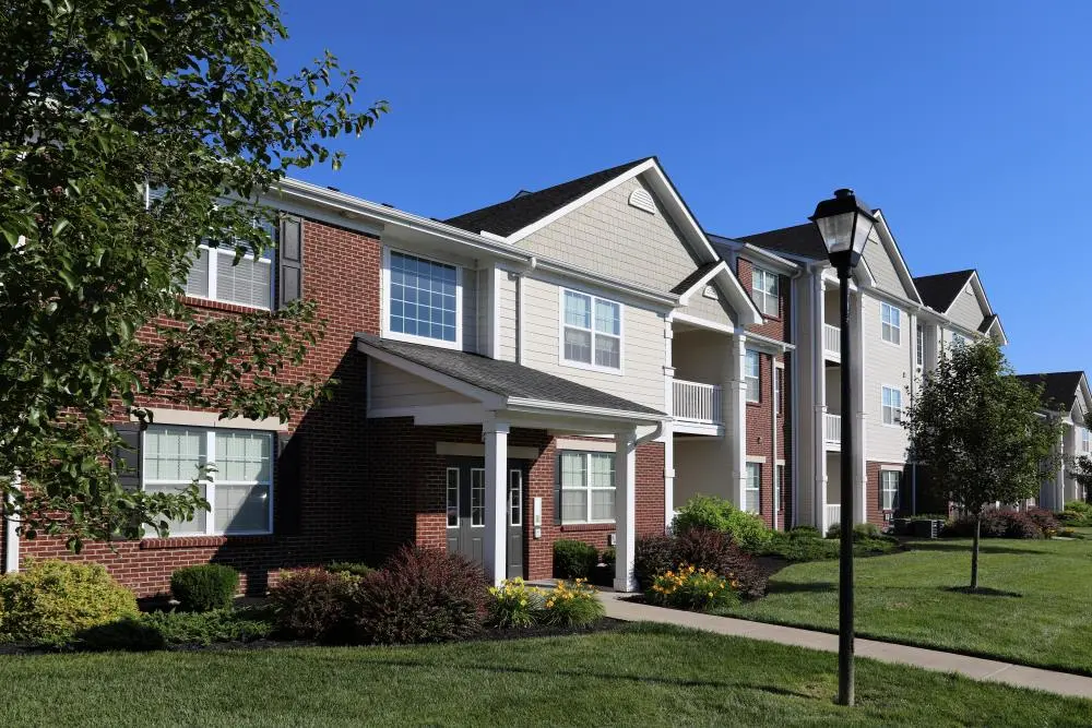 Exterior of Brinley Place apartment home facades and lawn.