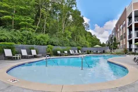 Outdoor pool and chairs at Element Oakwood