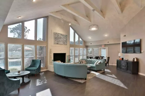 The interior of the Fox Chase North community clubhouse with fireplace.