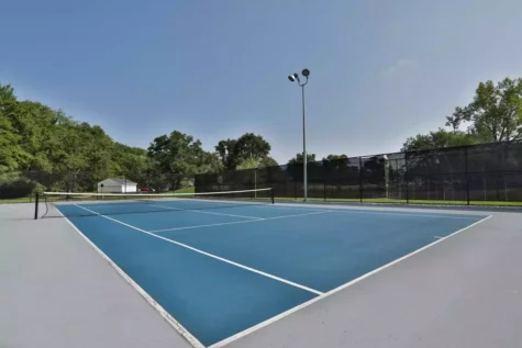 Fox Chase North's residential fenced-in tennis courts.