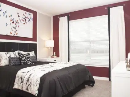 Bedroom with maroon paint at Allure apartments