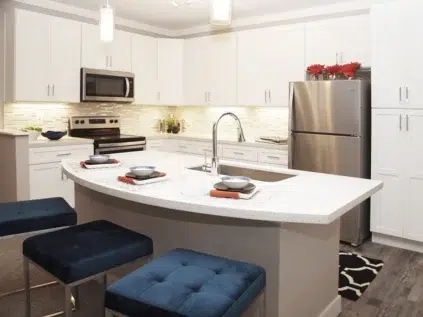 Allure apartments kitchen area. Seated island and sink