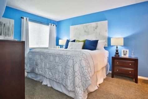 Fox Chase North Apartments bedroom, large bed, nightstand and dresser