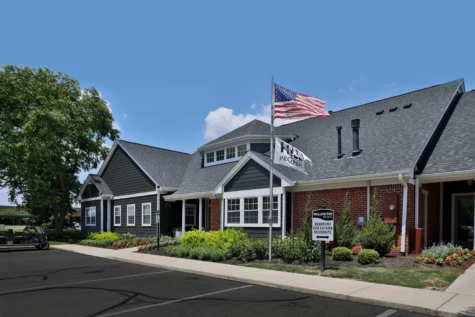 Clubhouse and entrance to leasing office Wellington Place in Fishers, IN