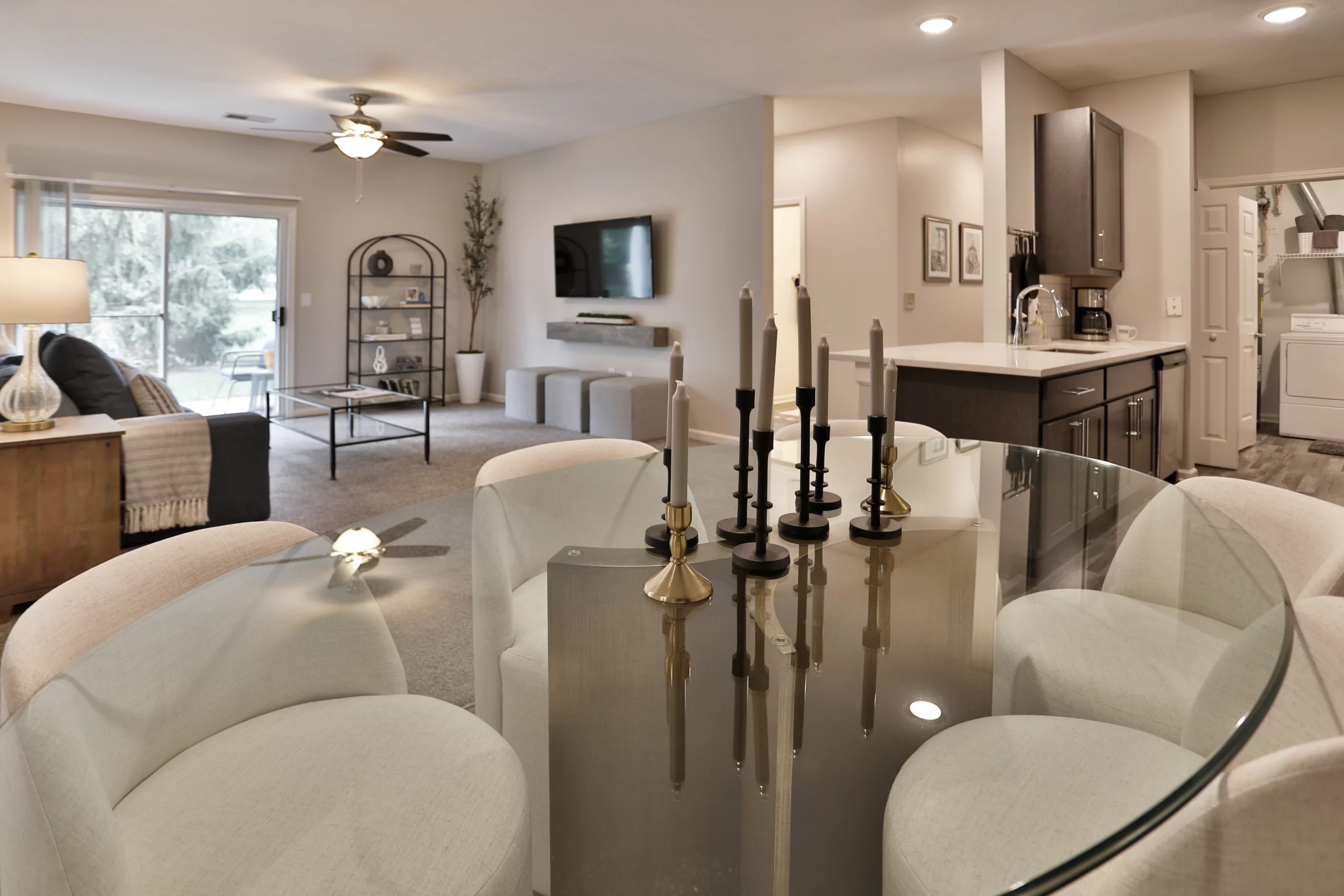 Model 3 Wellington Place Apartments in Fishers, IN. Modern. Living space, dining area and kitchen